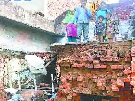 house demolished, mother and children injured